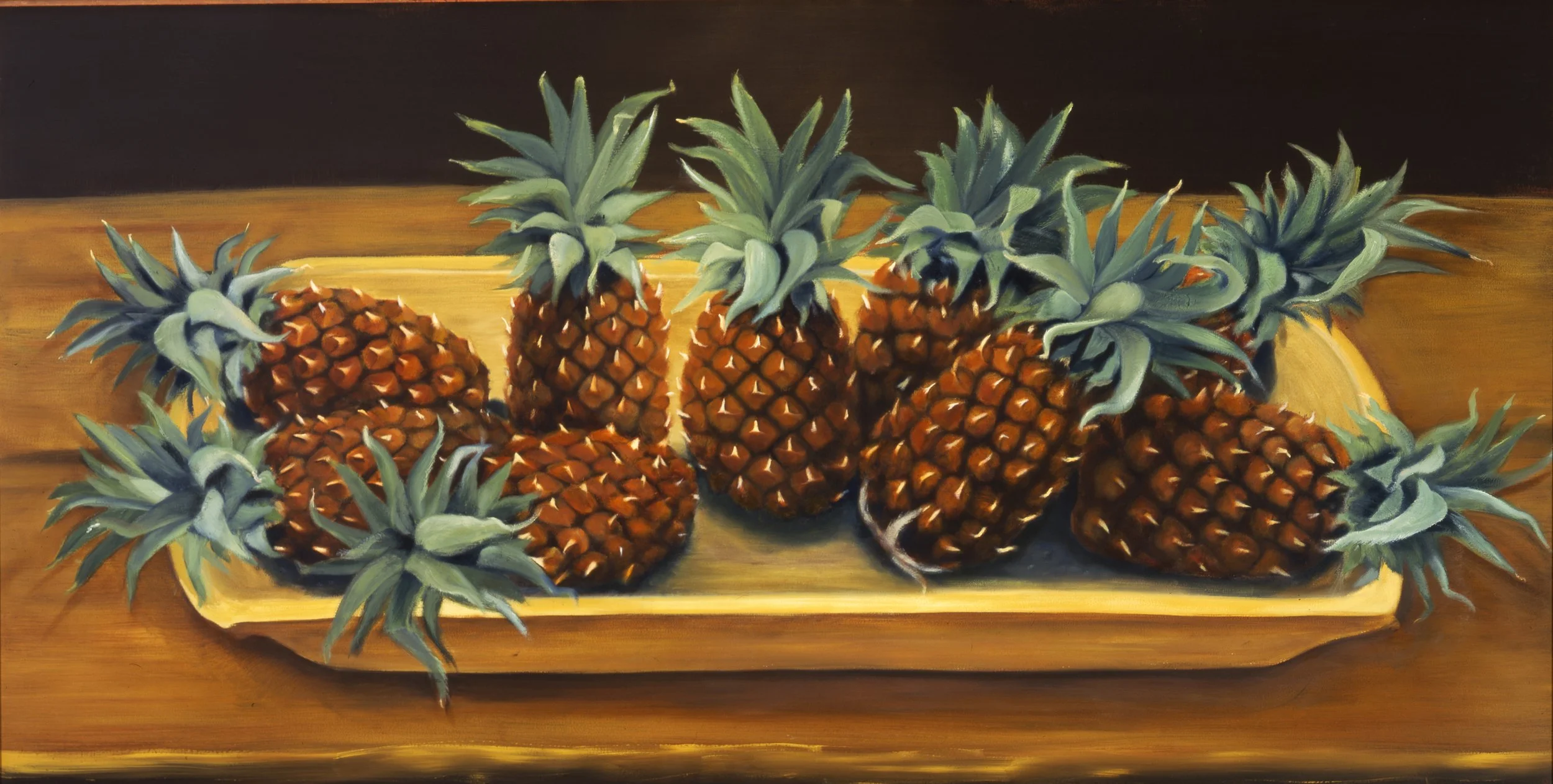 A painting of multiple pineapples with green spiky leaves on a wooden tray.