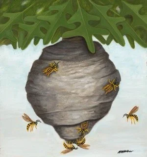 A beehive hanging from green leaves with several bees around it.