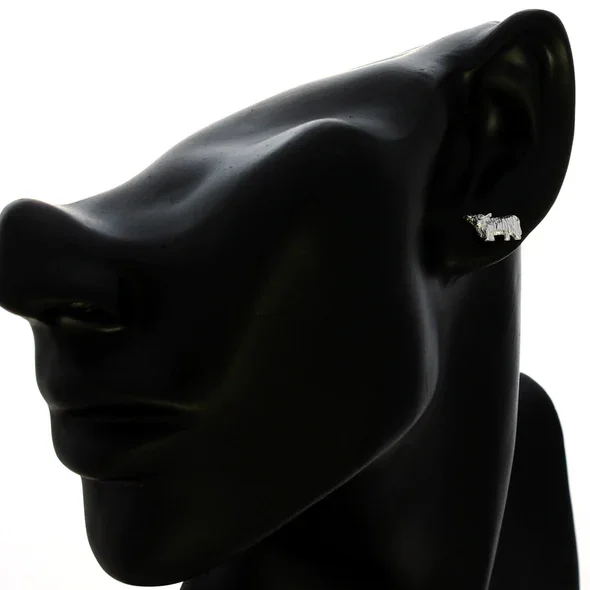 Sterling Silver Scottish Highland Cow Stud Earrings, sculpted form, engraved coat detail, 12mm x 7mm, push back fitting, shown on modelling bust at ear giving scale