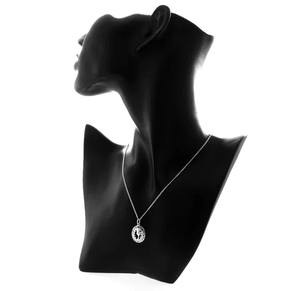 Sterling Silver Scottish Thistle Pendant, open oval frame, feathered head, crosshatched globe, pierced leaf detail, shown on modelling bust at neckline giving scale