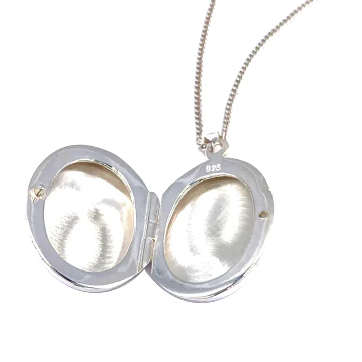Sterling Silver oval photo locket. Plain high mirror polish, smooth curved edges, showing internal photo clasps
