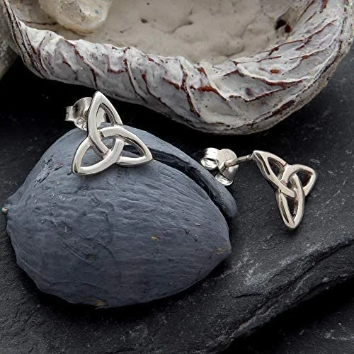 Sterling Silver Celtic Trinity Knot Stud Earrings, open triquetra design, high mirror polish, push back fitting, shown on Scottish slate with sea stones and dried botanicals