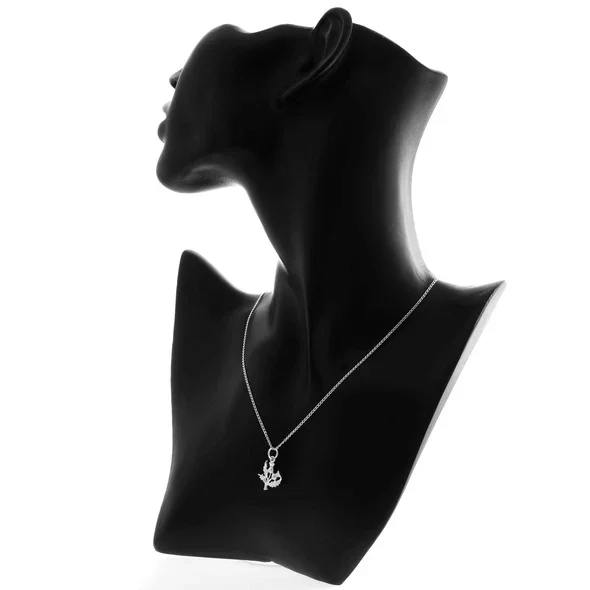Sterling Silver Scottish Thistle Pendant, twin-head botanical form, feathered crowns, crosshatched globes, shown on modelling bust at neckline giving scale