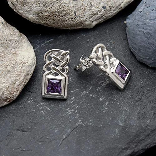 Sterling Silver Celtic Knotwork Stud Earrings, square-cut amethyst bezel set, plaitwork panel, push back fitting, shown on Scottish slate with sea stones