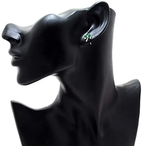 Sterling Silver Celtic Shamrock Stud Earrings, heart-cut green CZ claw set, three-lobe design, push back fitting, shown on modelling bust at ear giving scale