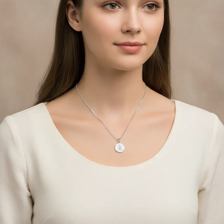 Sterling Silver St Christopher pendant, shown on model at neckline giving scale