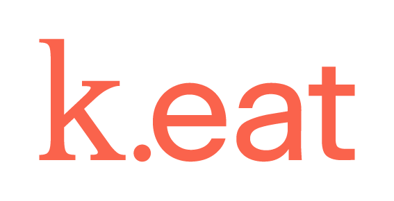 Texto que dice 'k.eat' en letras rojas y estilizadas sobre un fondo negro.