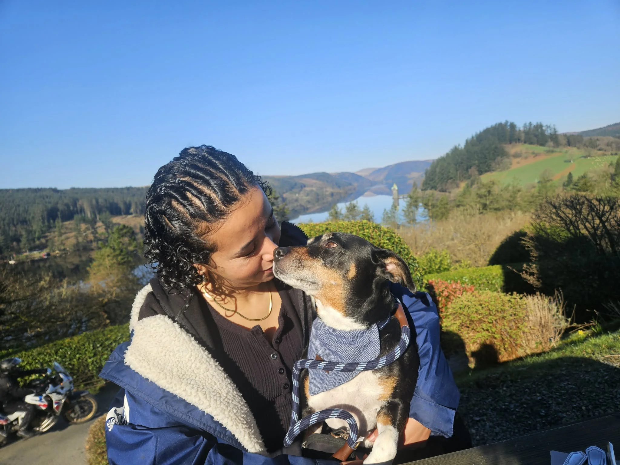 Picture of reham and her dog looking at each other