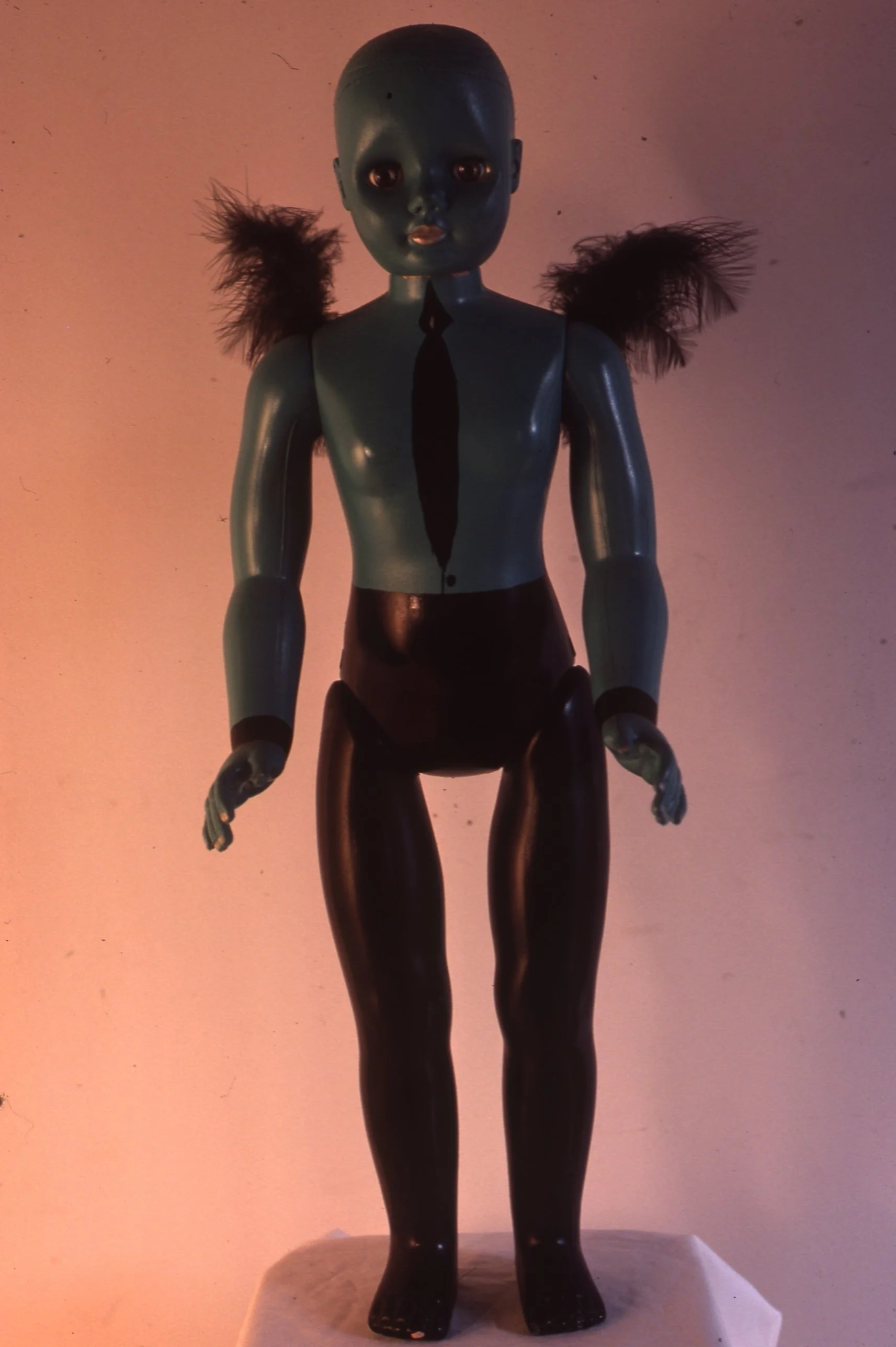 Enamel on Plastic Doll and Feathers 1979