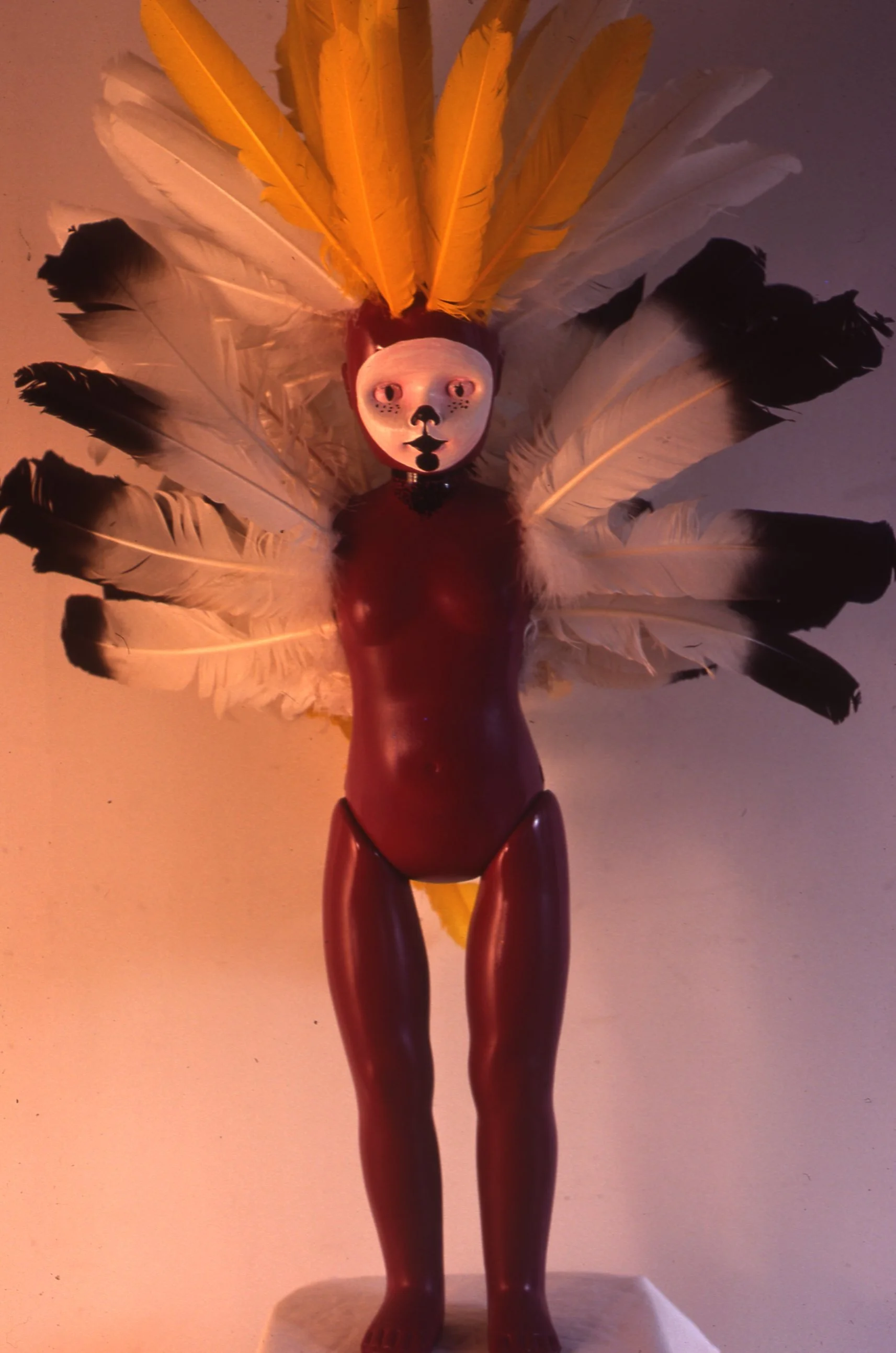 Enamel on Plastic Doll and Feathers 1979