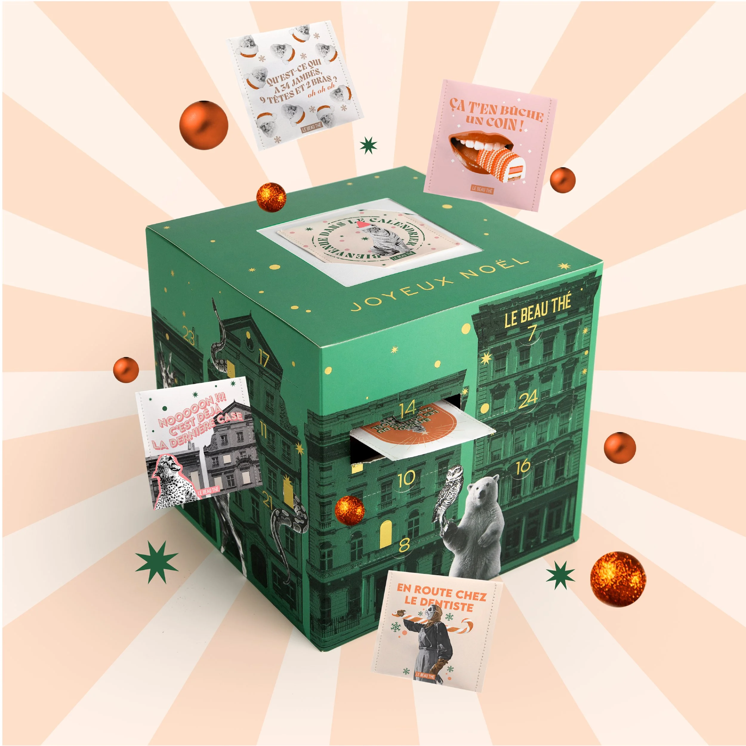 A green advent calendar box decorated with animals and stars, with numbered doors and various festive notes and images, surrounded by orange and green holiday ornaments and star-shaped decorations on a light pink and cream background.