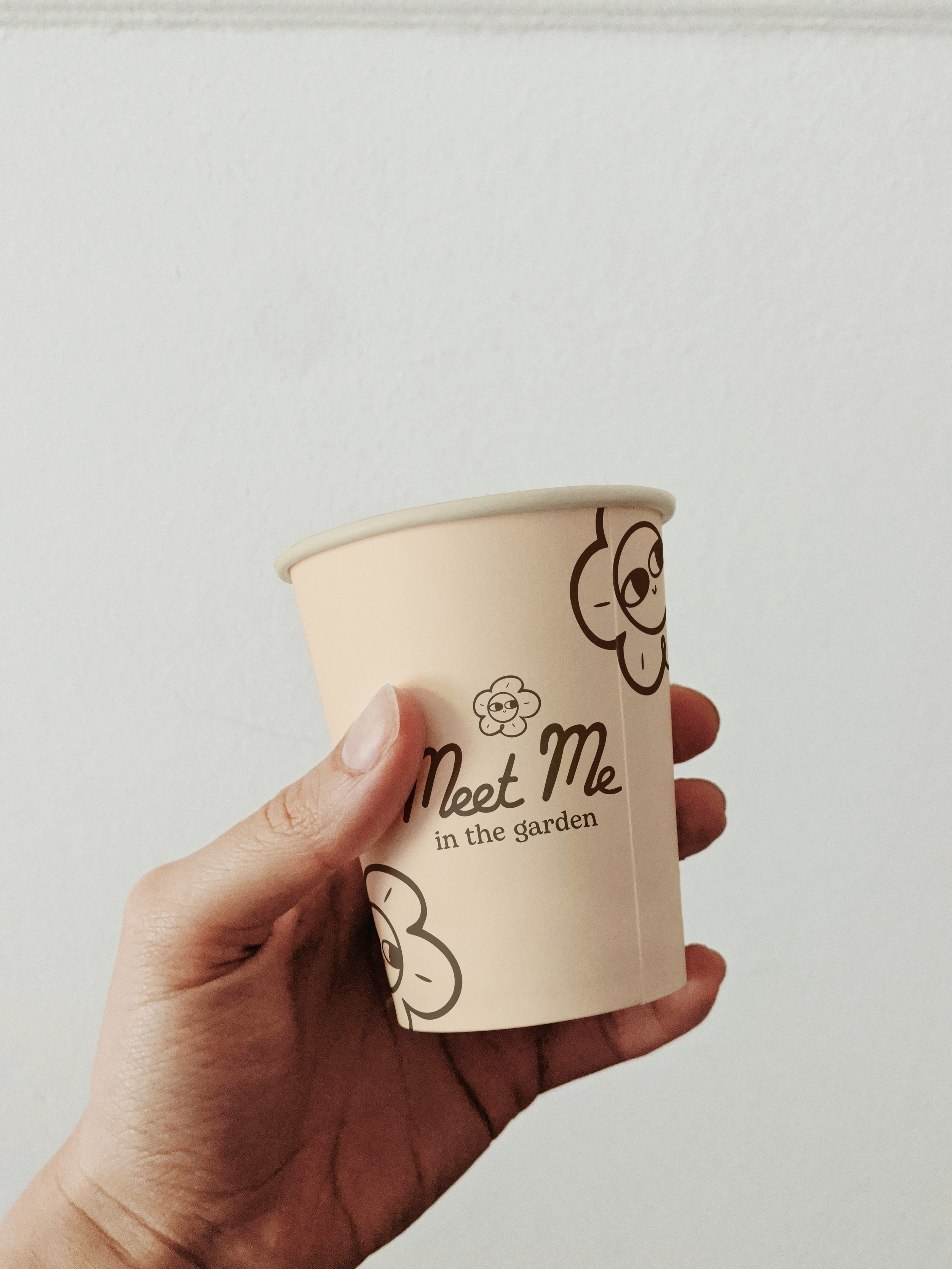 cupmockuphandholding.png