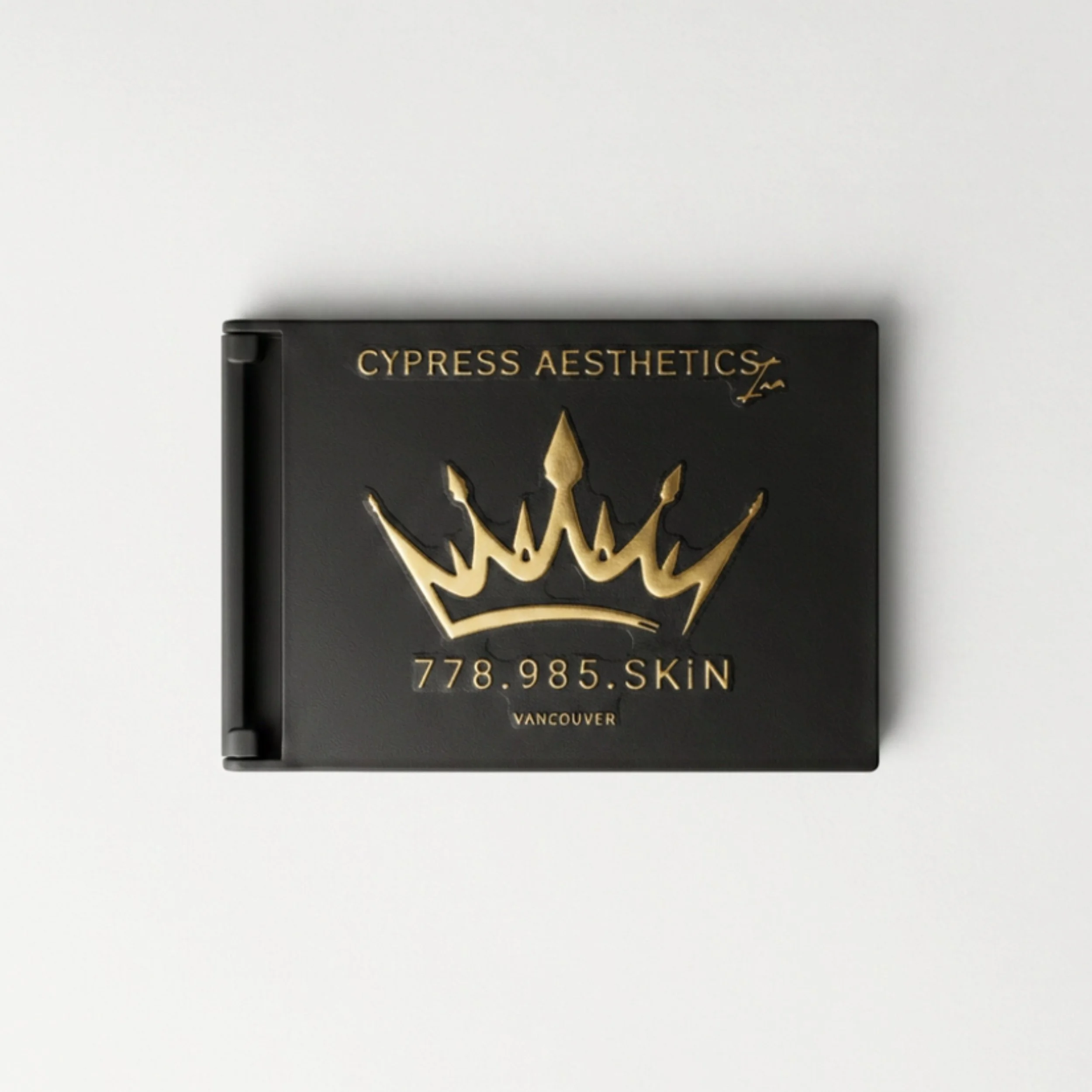 Close-up of black packaging box with gold lettering and design, displaying 'Cypress Aesthetics' and a logo, along with a product code and location '778985 SKIN Vancouver' visible.