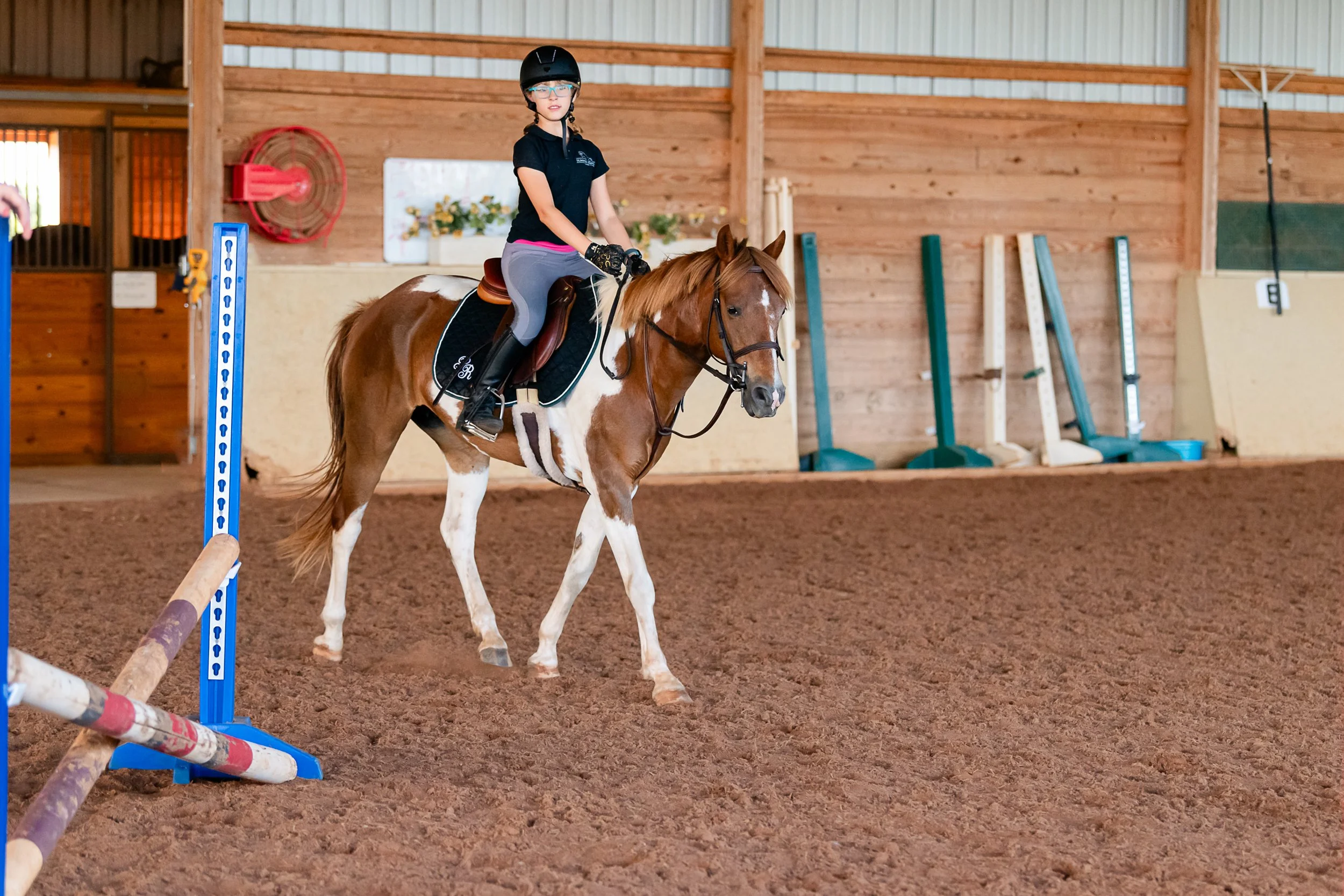Riding lesson with girl on pony