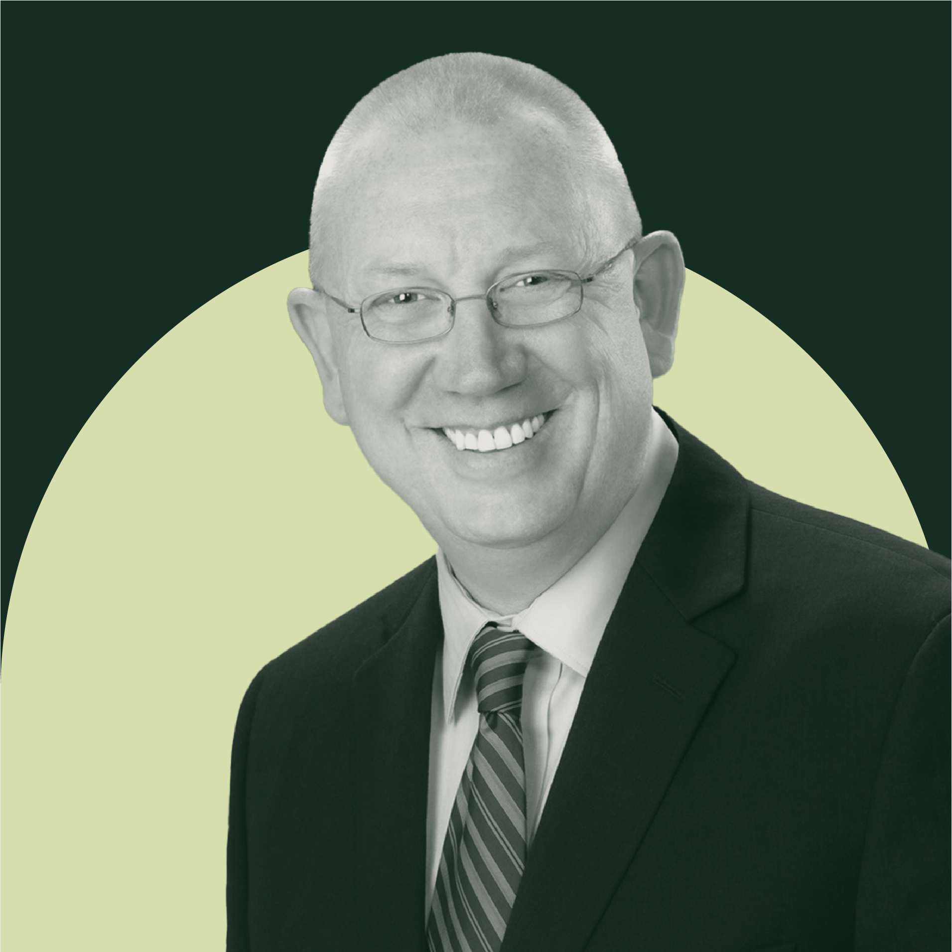 A smiling man with glasses wearing a business suit and striped tie, against a geometric background in shades of green.