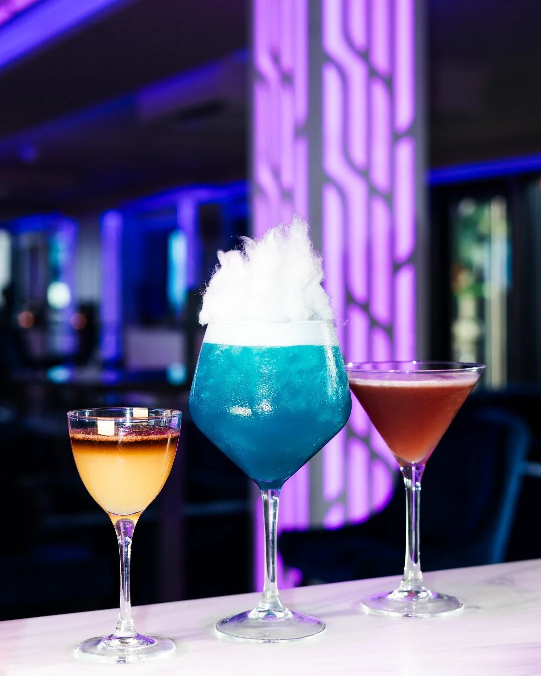 Golden hour just hits different at Above ✨ 

Three cocktails. Three spots. One very good decision.

First stop, lined up on the bar, looking all kinds of irresistible.
Next, centre stage on a table in the main bar, because they deserve their moment.

