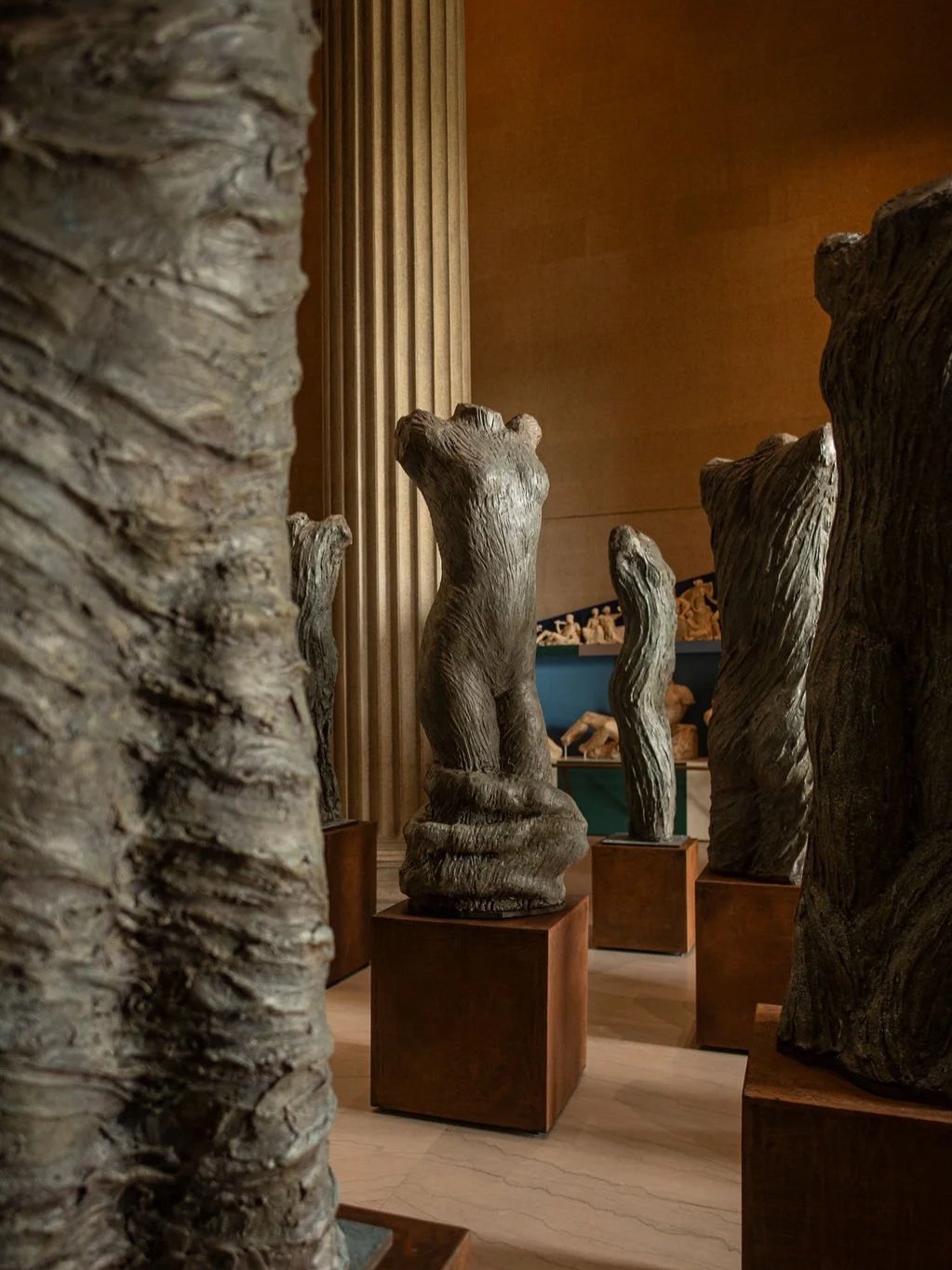 Plaster sculptures of an abstract torso figures in a museum exhibit. At the Parthenon Museum.