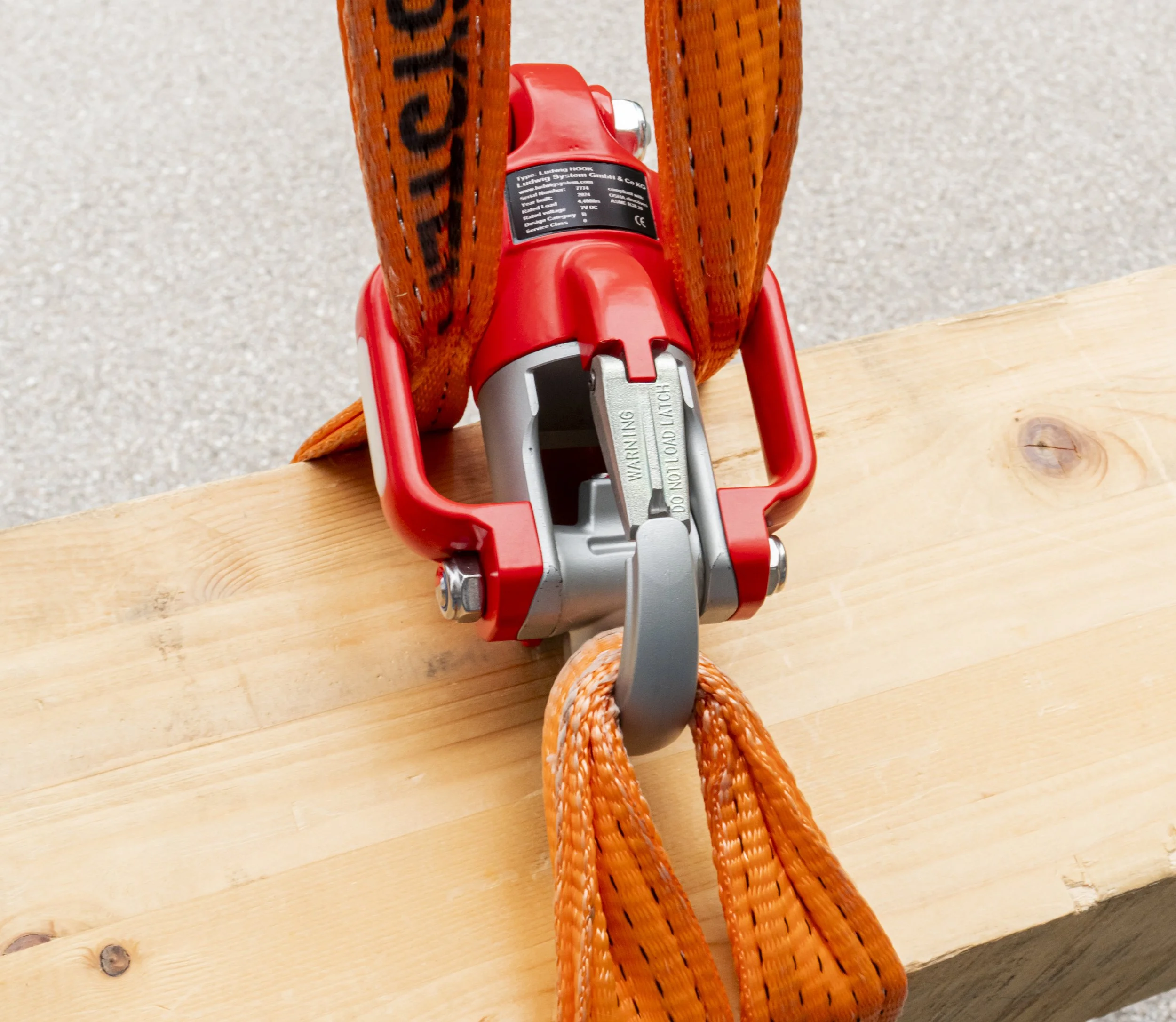 Ludwig Hook lifting a heavy wooden beam