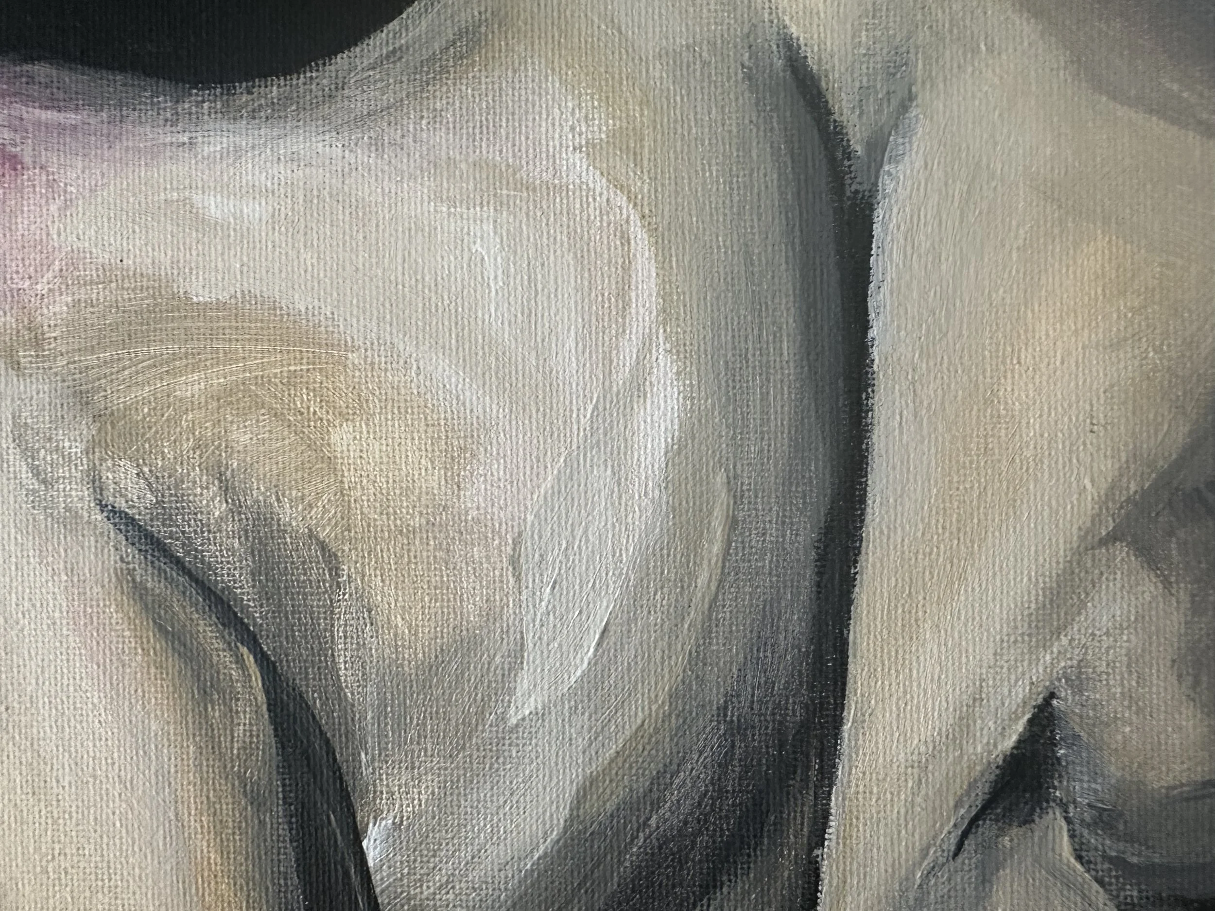 Close-up of abstract beige, white, gray, and black acrylic paint strokes on canvas.