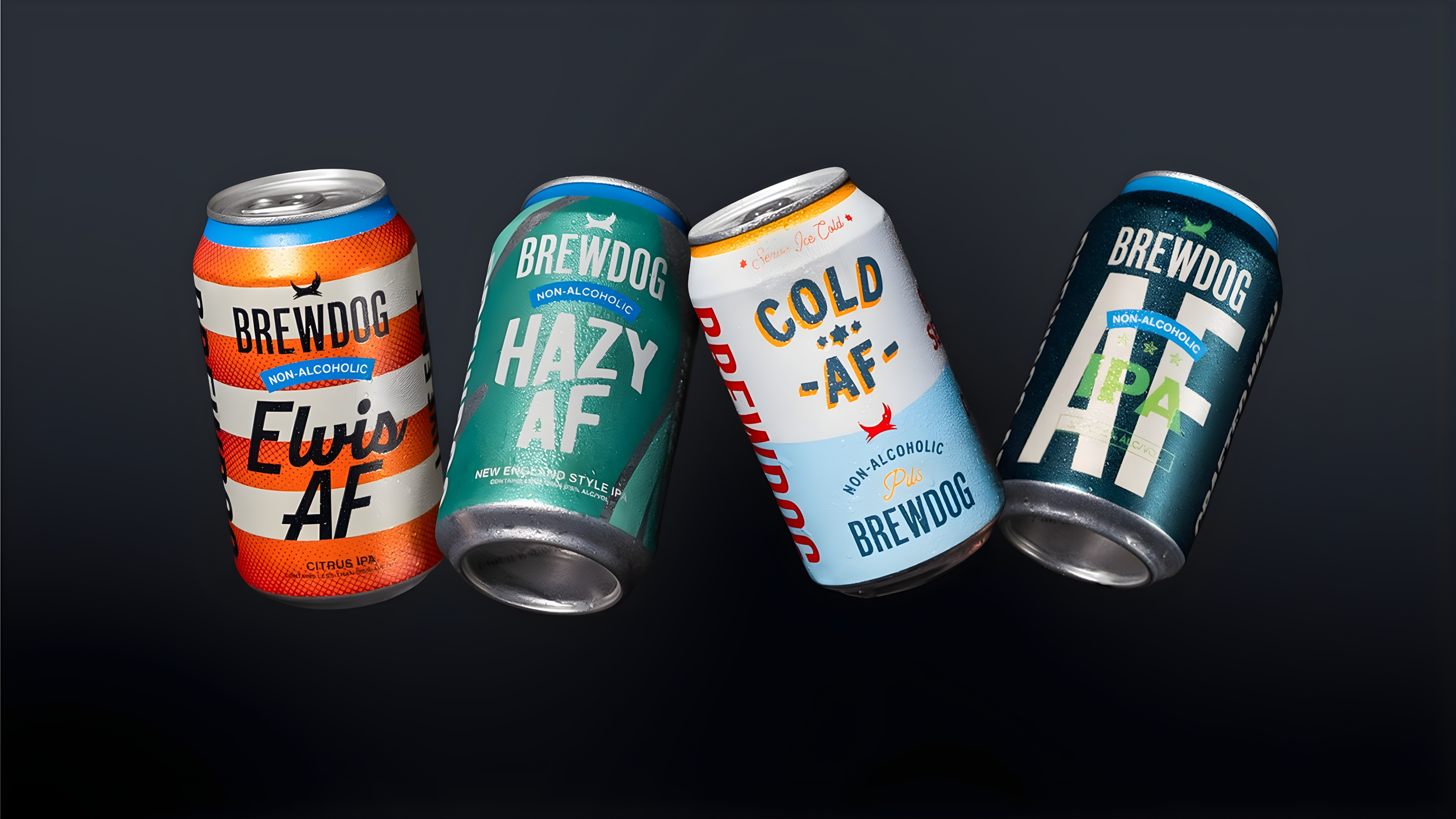Four cans of Brewdog non-alcoholic beer with colorful labels, lying on a dark surface.