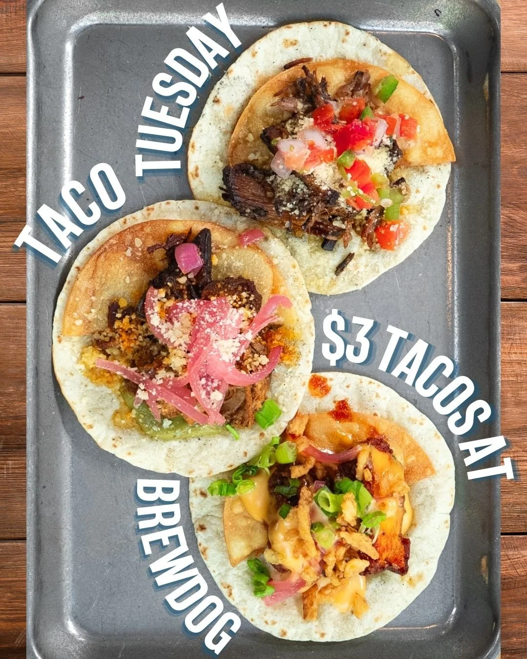 Three tacos on a metal tray with various toppings and sauces, with text overlay indicating prices: two tacos at three dollars each and one breakfast taco.