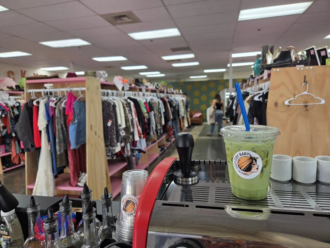 Branded Cry Baby Coffee Catering iced matcha on espresso machine at indoor pop-up event in Boise, Idaho Indy Clover Retail event.