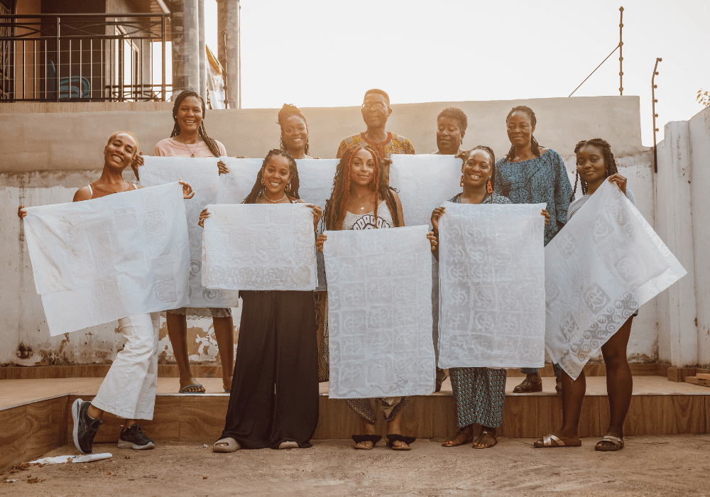 Group of women showing their Batik Fabric during a Batik Making experience in Ghana