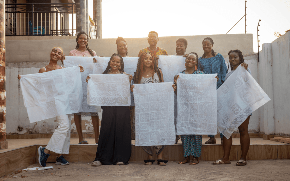 Group of women showing their Batik Fabric during a Batik Making experience in Ghana