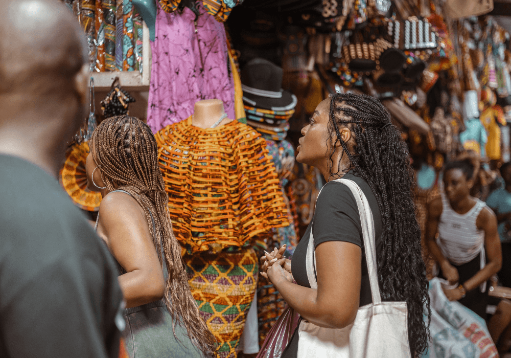 A group of diasporans shopping at the Accra Arts Centre for local crafts