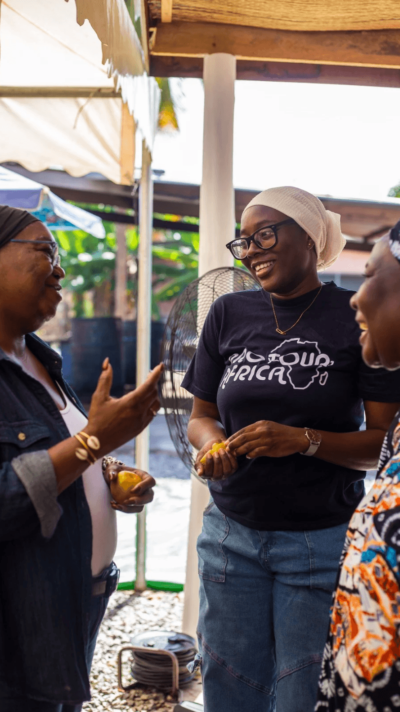 A Tour guide, a tour guest and Batik facilitator having a conversation