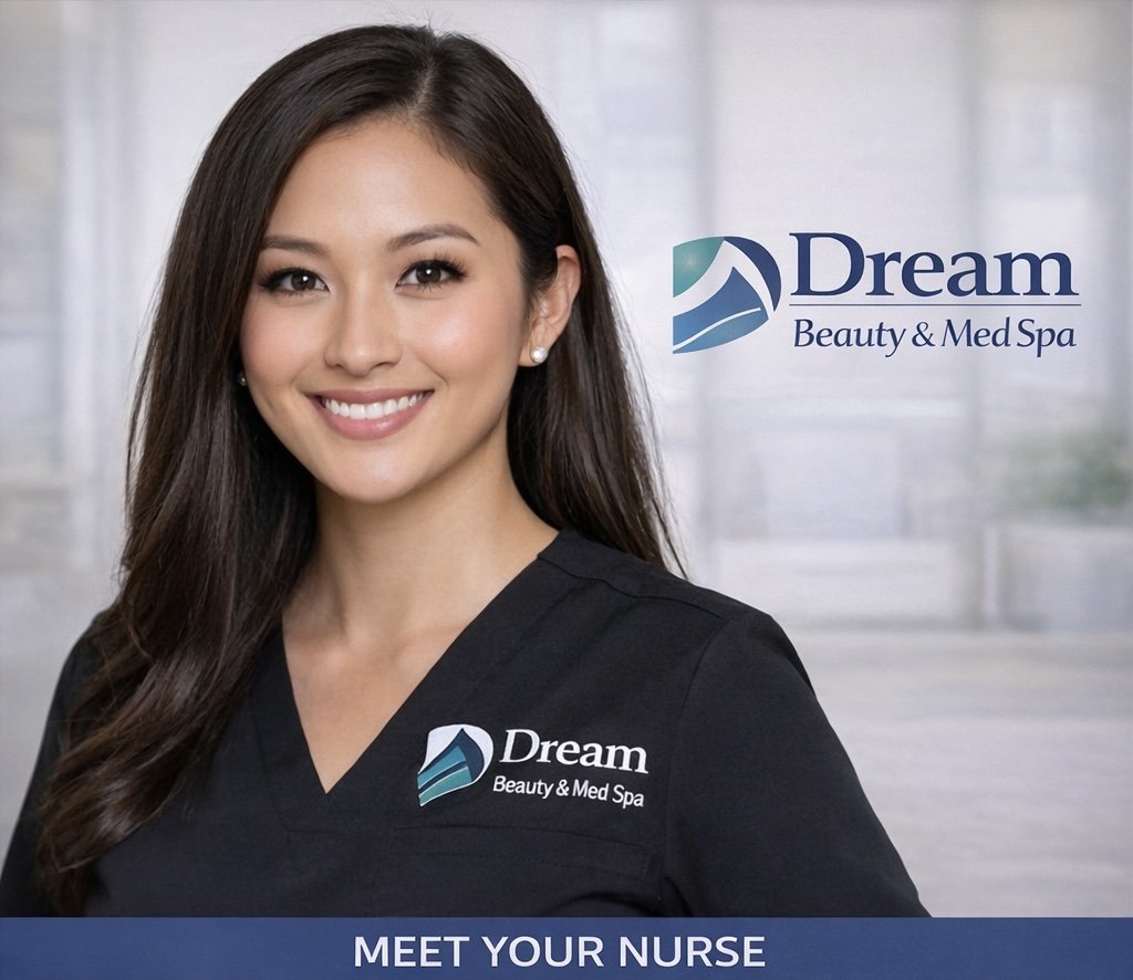 A young woman with long dark hair and a bright smile, wearing a black medical uniform with a logo for Dream Beauty & Med Spa, standing in front of a blurred window background with the same logo and the text "MEET YOUR NURSE."