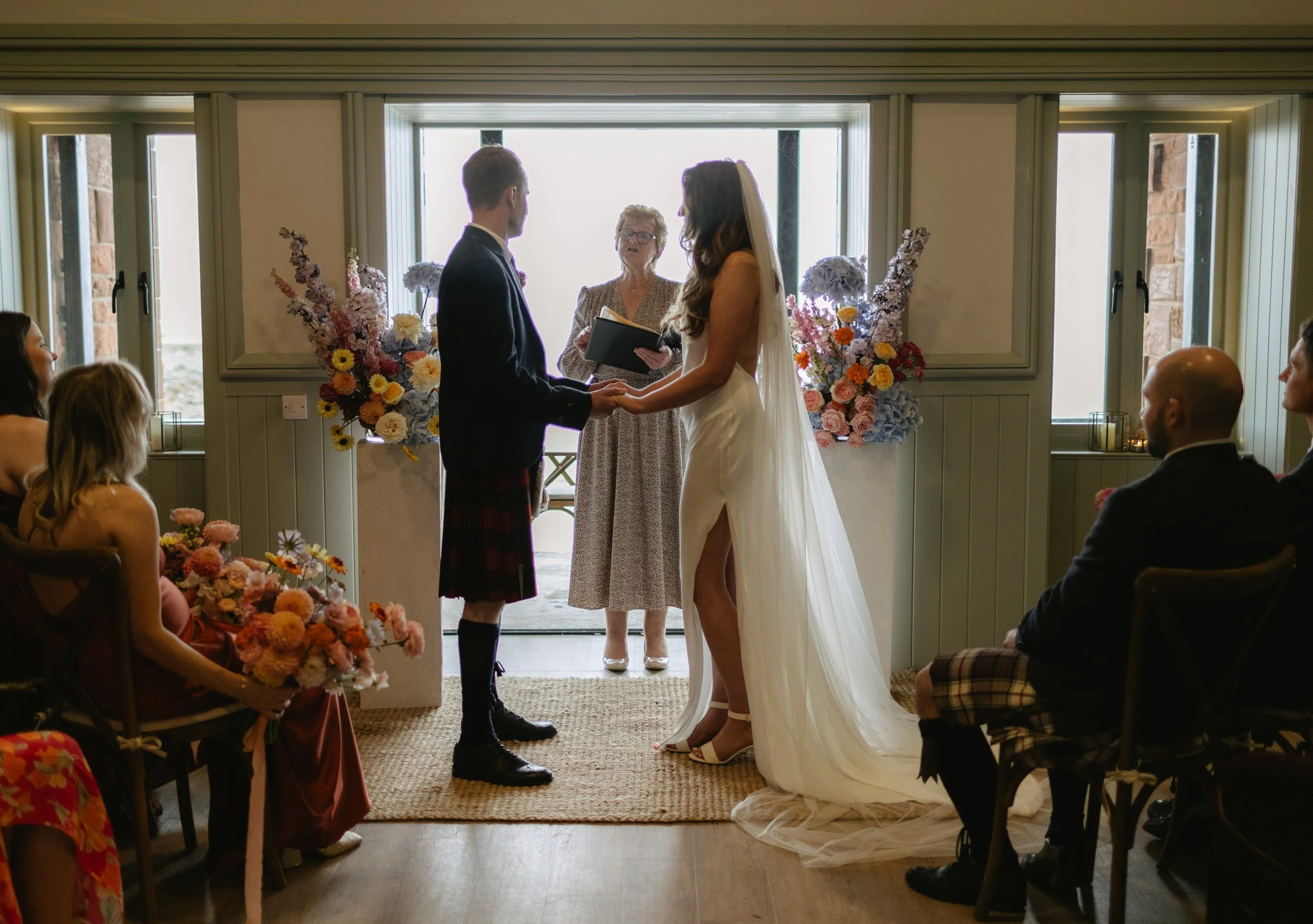 bride and groom ceremony at a coastal venue