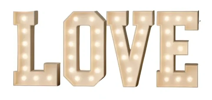 Marquee-style lights spelling out the word 'LOVE' in capital letters.