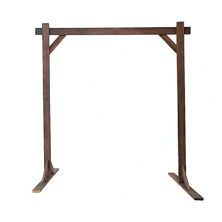 A wooden outdoor wedding arch or arbor with a horizontal top beam and two vertical side posts, set against a plain white background.
