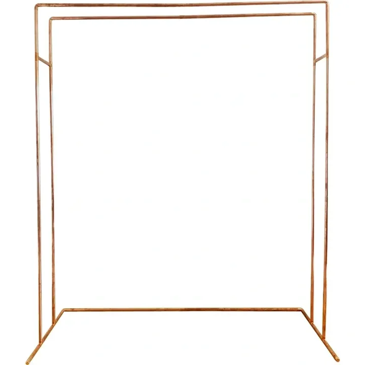 A copper-colored wedding arch with a minimalist rectangular frame design.