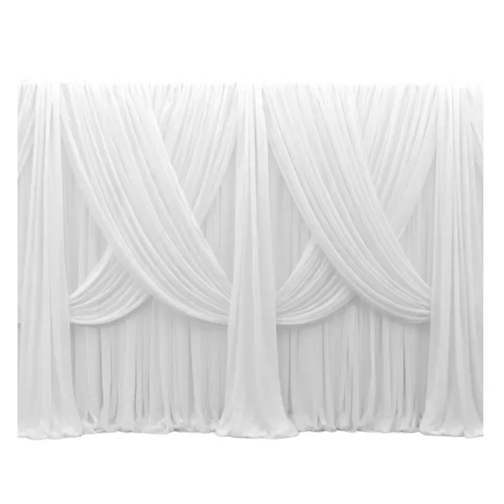 White draped curtains hanging elegantly, forming a decorative backdrop.