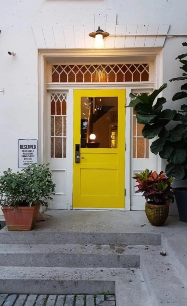 The Iconic Yellow door at the front of the Drake Devonshire in Wellington