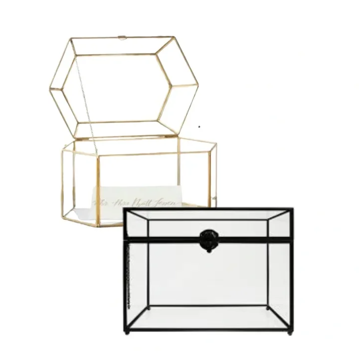 Two card boxes, one gold and open with a note inside, and one black and closed.
