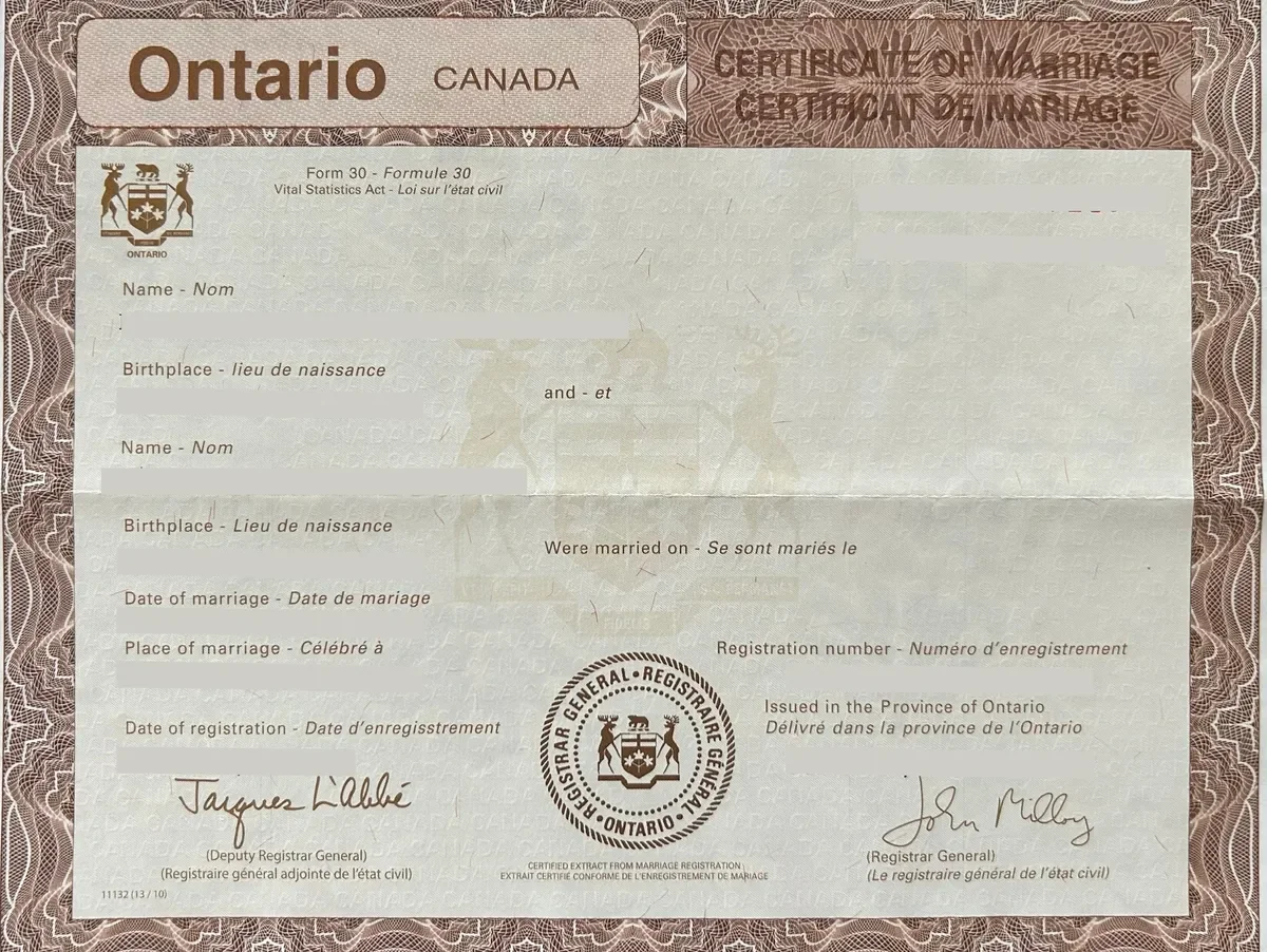 Ontario, Canada marriage certificate with signatures, official seals, and printed text in English and French.