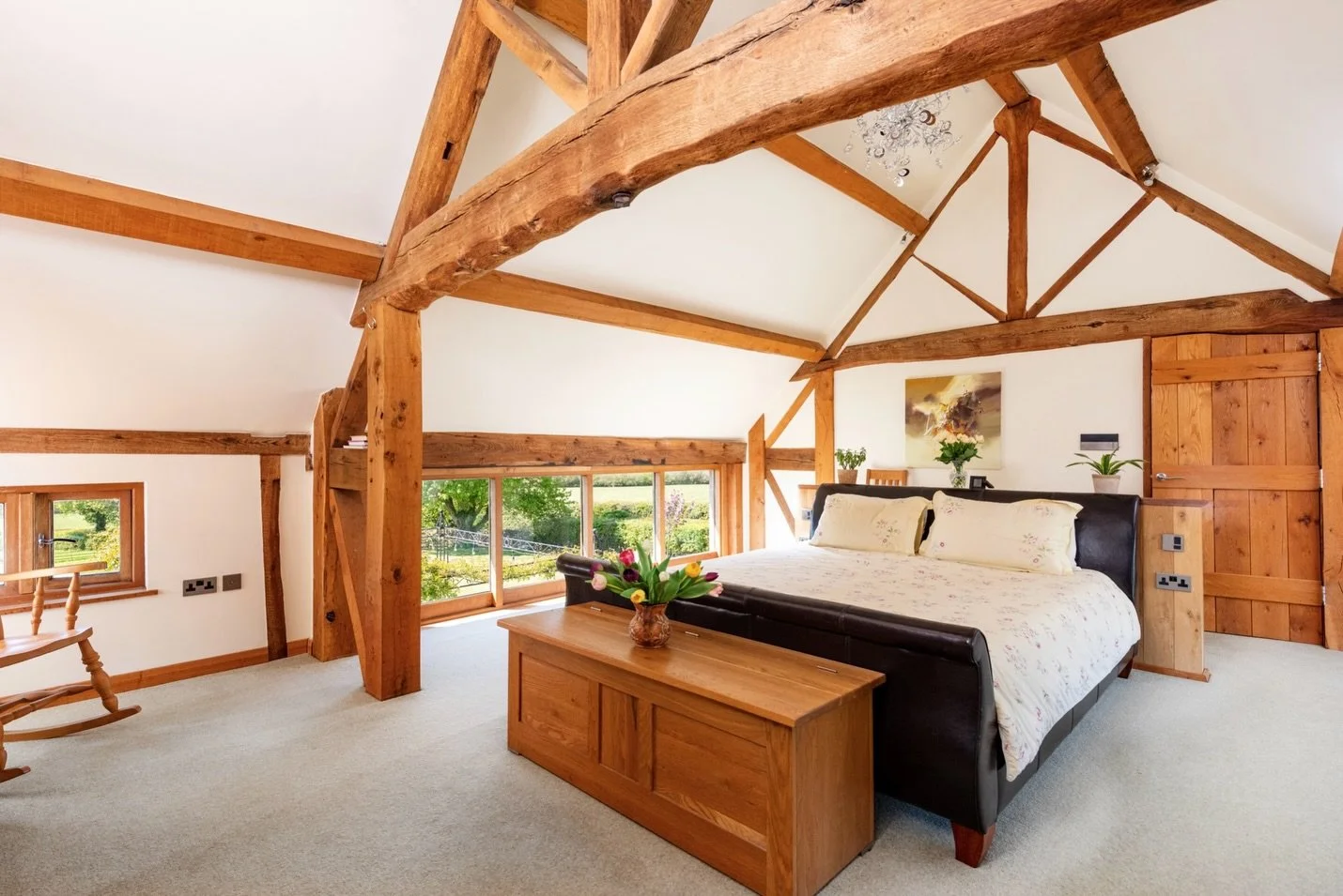 Step upstairs to the principal suite at Jubilee Barn in Hillesden where you'll find a beautiful vaulted ceiling bedroom, exposed beams, a dressing area, and a luxurious walk-in wet room style ensuite, all with views of the surrounding gardens.
~
@fis