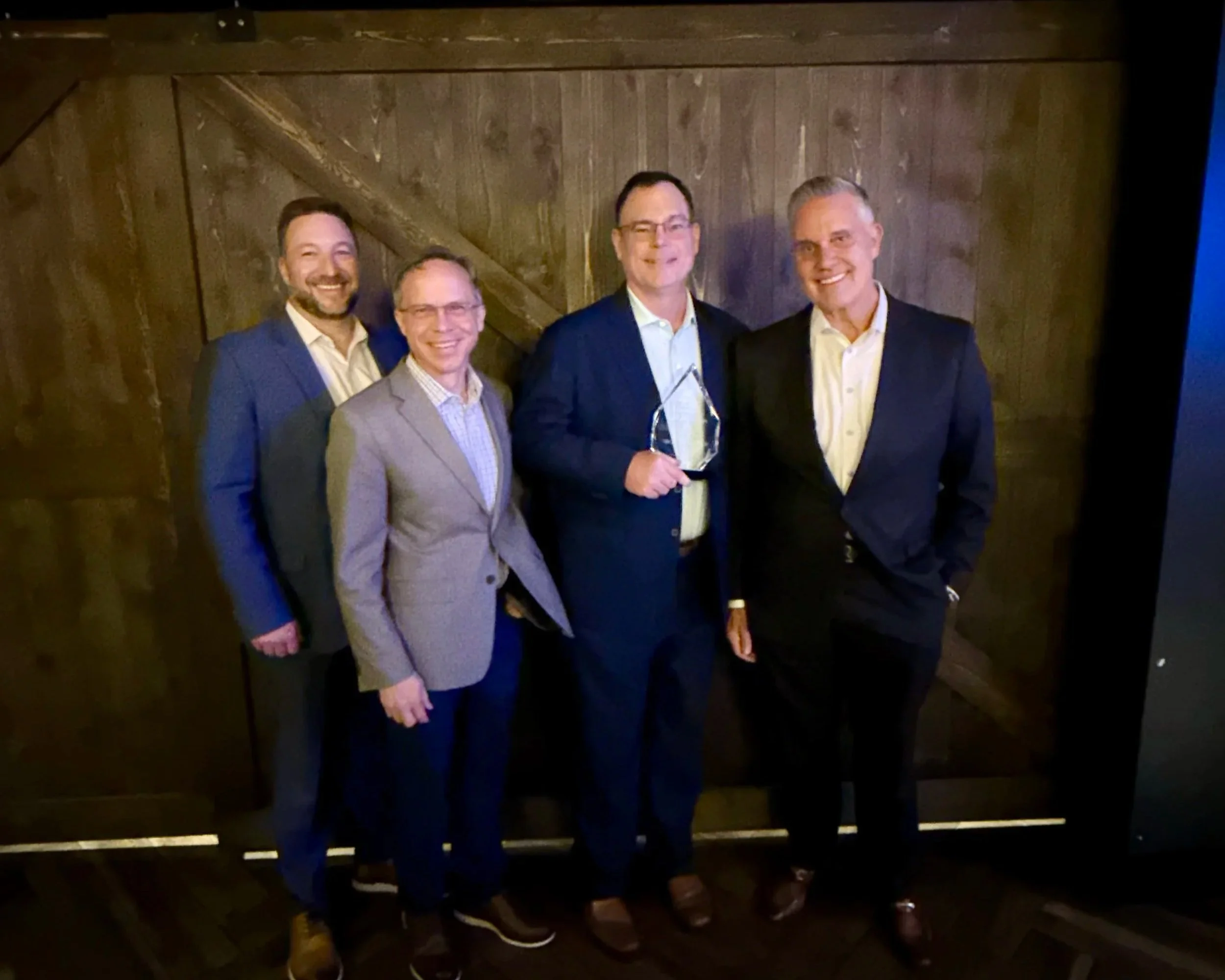 Dr. Randall Schultz with hospital colleagues after being named Physician of the Year, an honor voted on by the nursing and surgical staff.