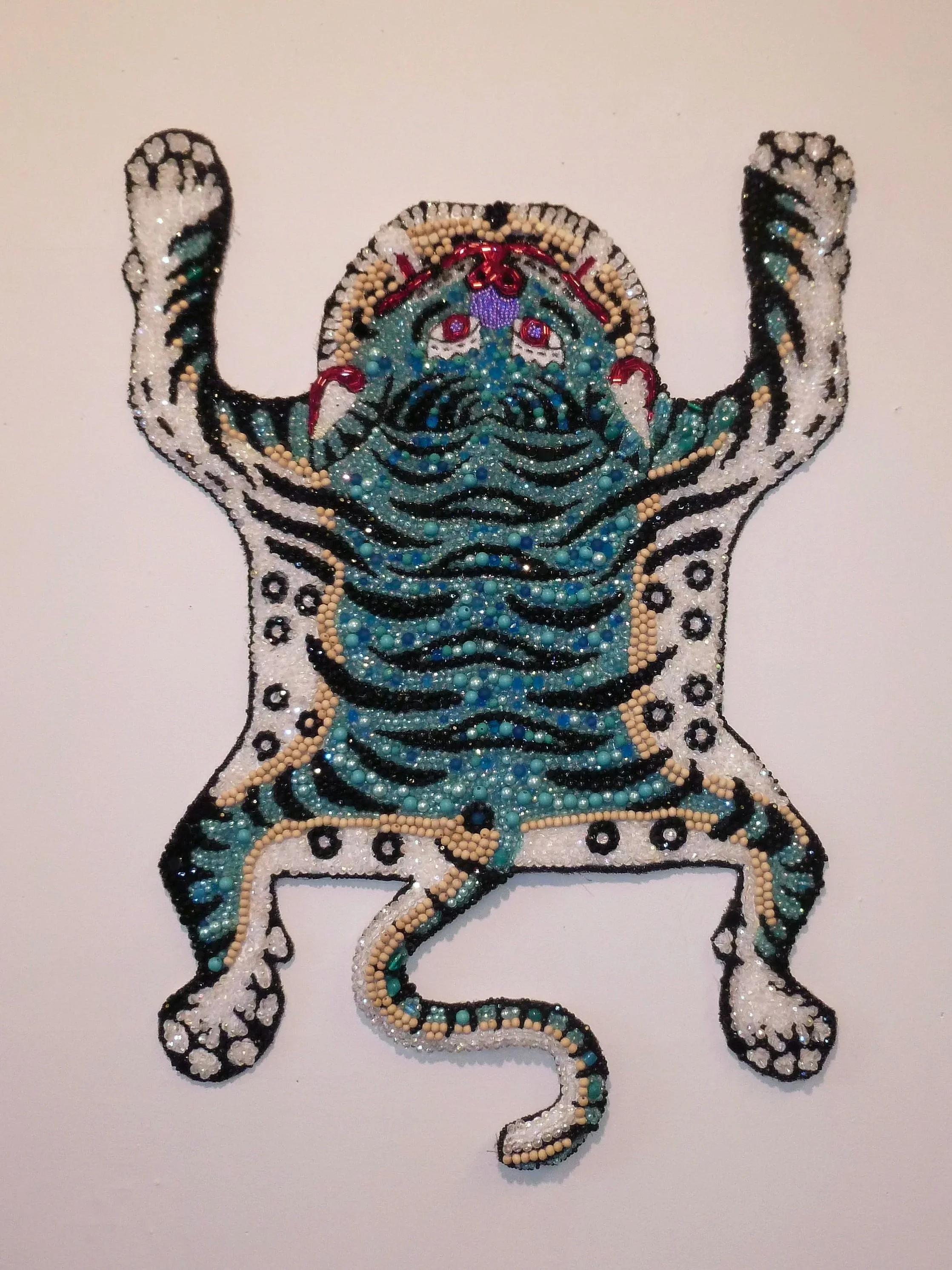 "Tibetan Tiger" 36x25 2024

Second-hand Fabric, Acrylic, Glass Beads, Wooden Beads, Plastic Beads, Stone Beads, Thread, Glue, Wire.