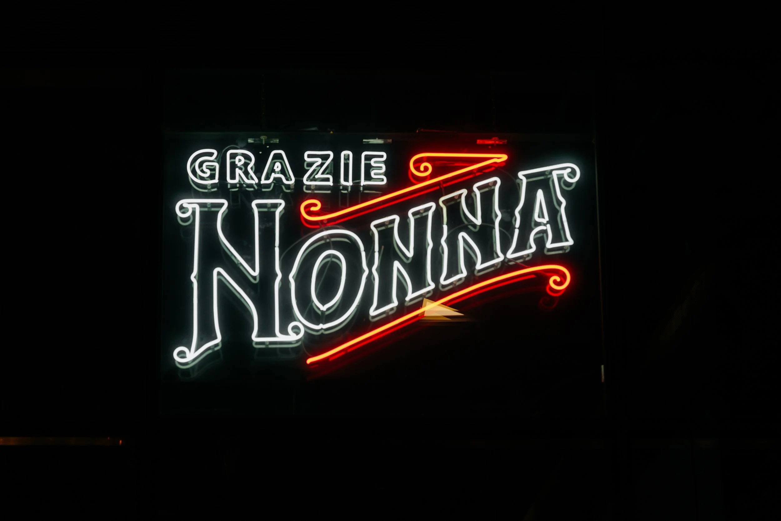 Neon sign for 'Grazie Nonna' restaurant in Washington DC.