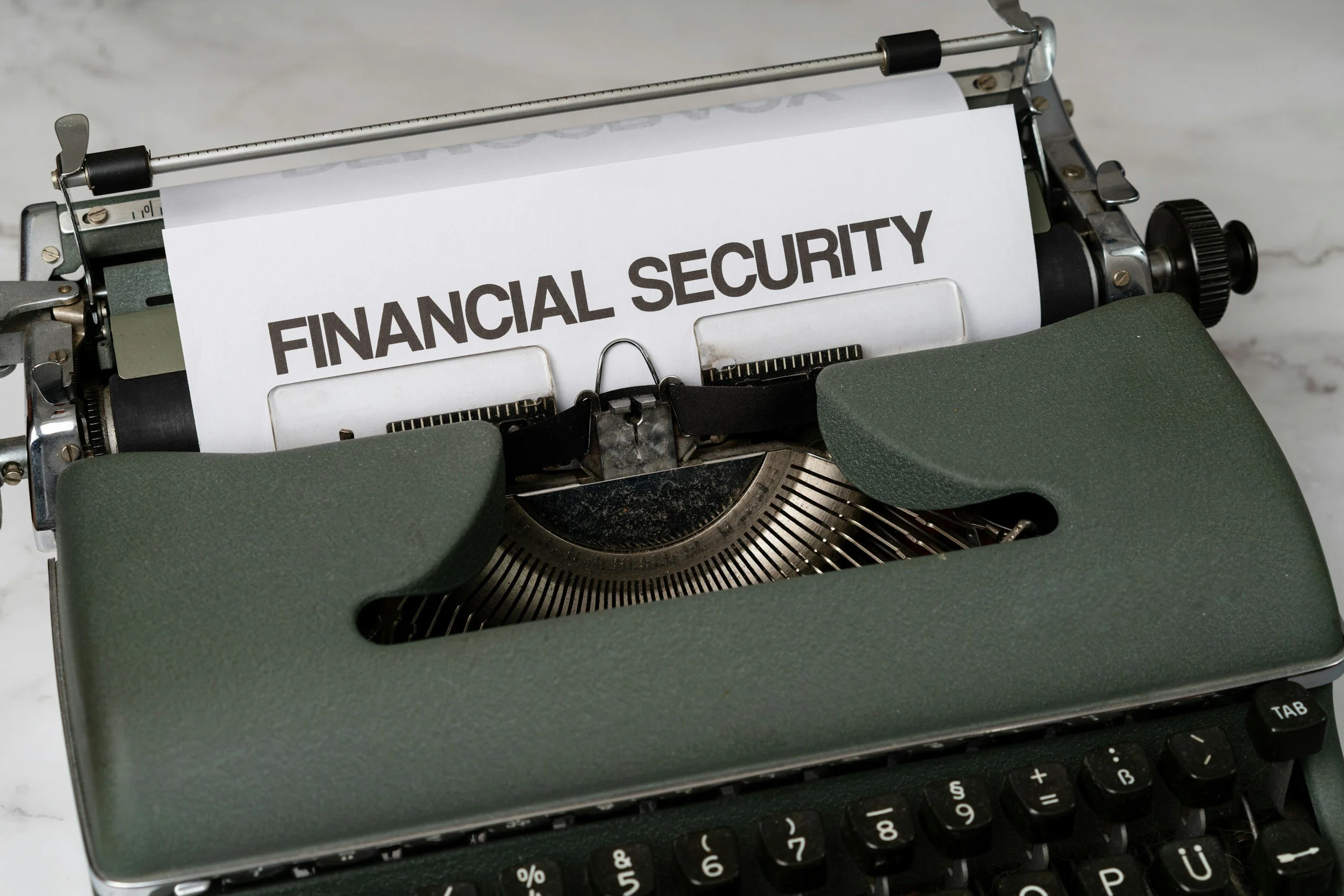 Typewriter with a paper that reads 'Financial Security' on it