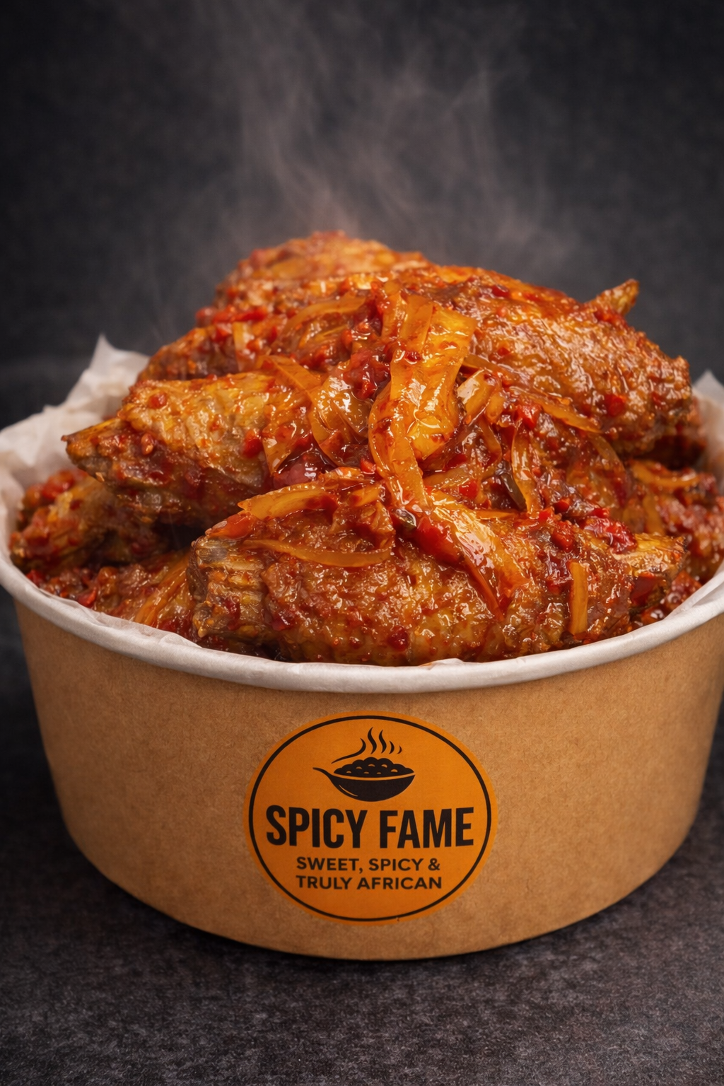 Spicy African-style chicken with a tomato-based sauce and onions in a brown paper bowl labeled 'Spicy Fame: Sweet, Spicy & Truly African'