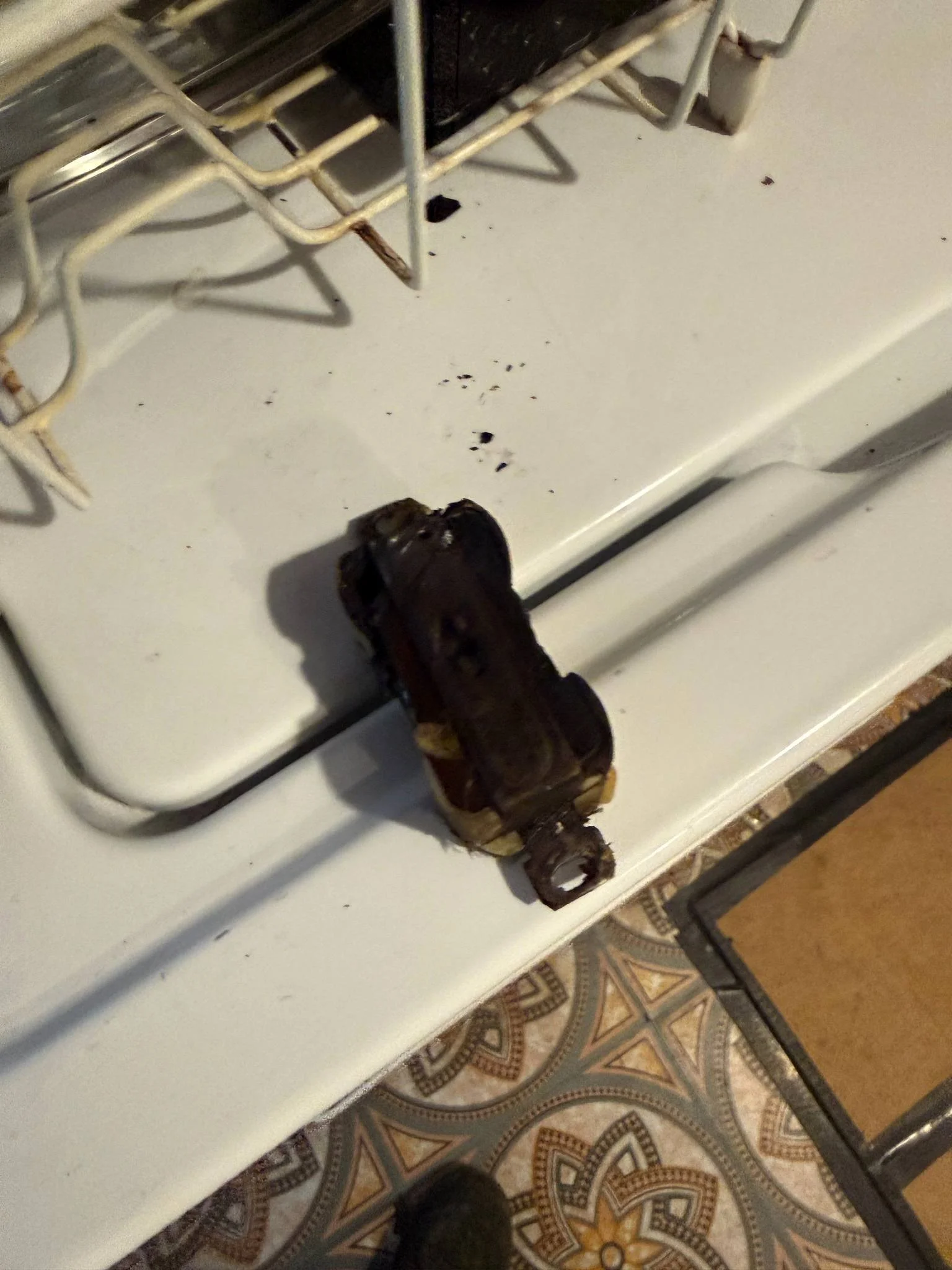 Electrical wiring and connection point exposed during residential troubleshooting and repair work to identify an electrical issue.