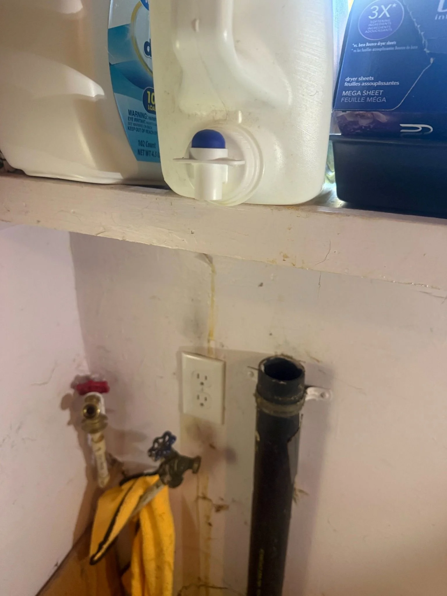 Residential electrical wiring and connection work completed beneath a kitchen sink during a home electrical installation project.
