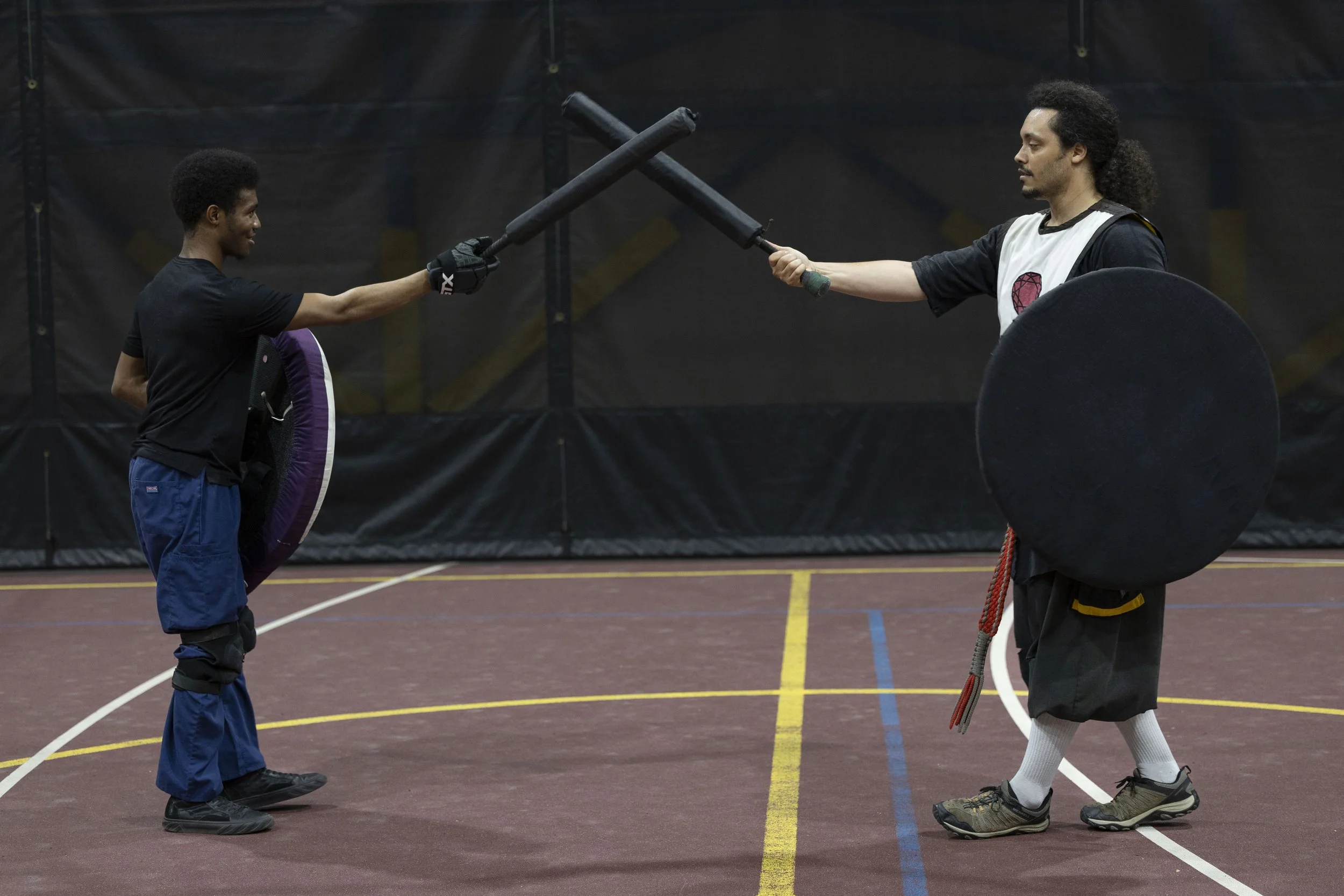 Quincy Washington (Q), left, lifts his sword up to meet David LaBoube (Fumbles), right, to indicate that he is ready for the match to start March 3, 2026 at the SIU Rec Center in Carbondale, Illinois. The Medieval Combat club meets Tuesdays and Frida