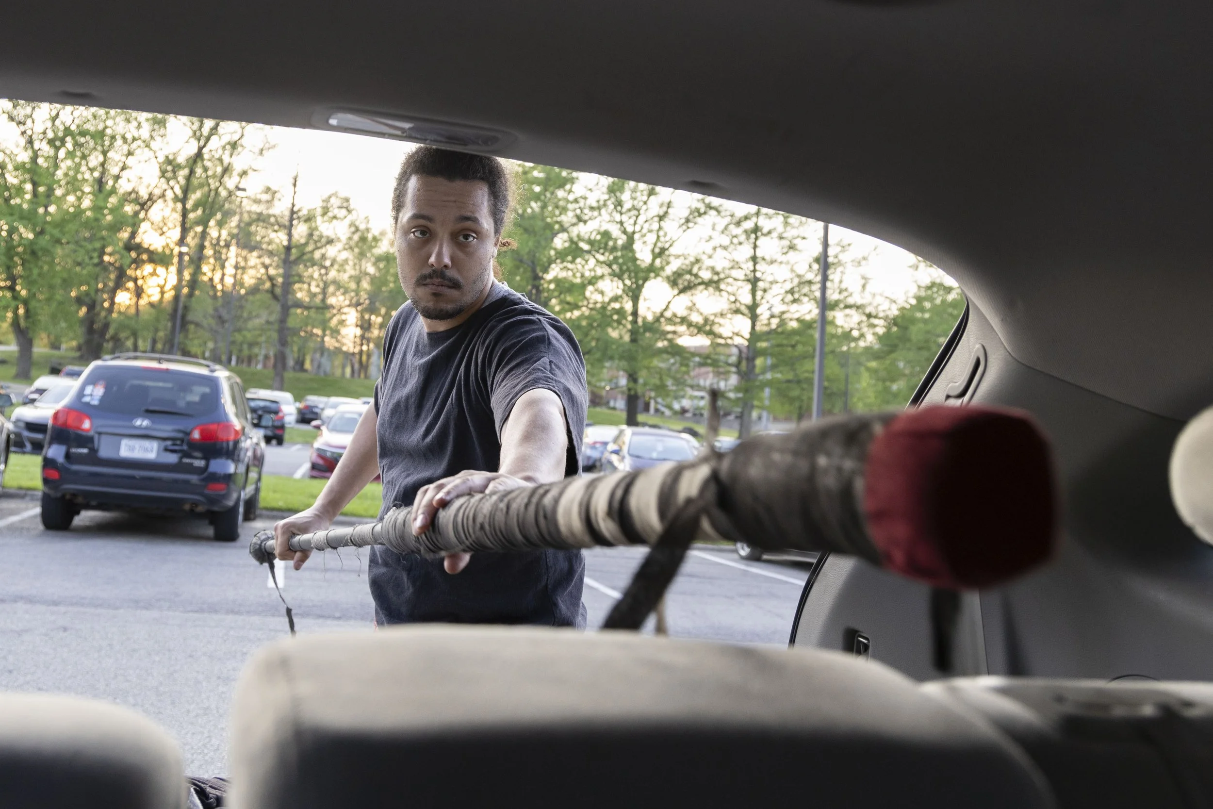 David LaBoube (Fumbles) places a foam spear in the trunk of his car April 14, 2025 in the Morris Library parking lot in Carbondale, Illinois. “I’ve been in this community for about 10 years. I started doing it here at SIU, and I’ve been with it ever 