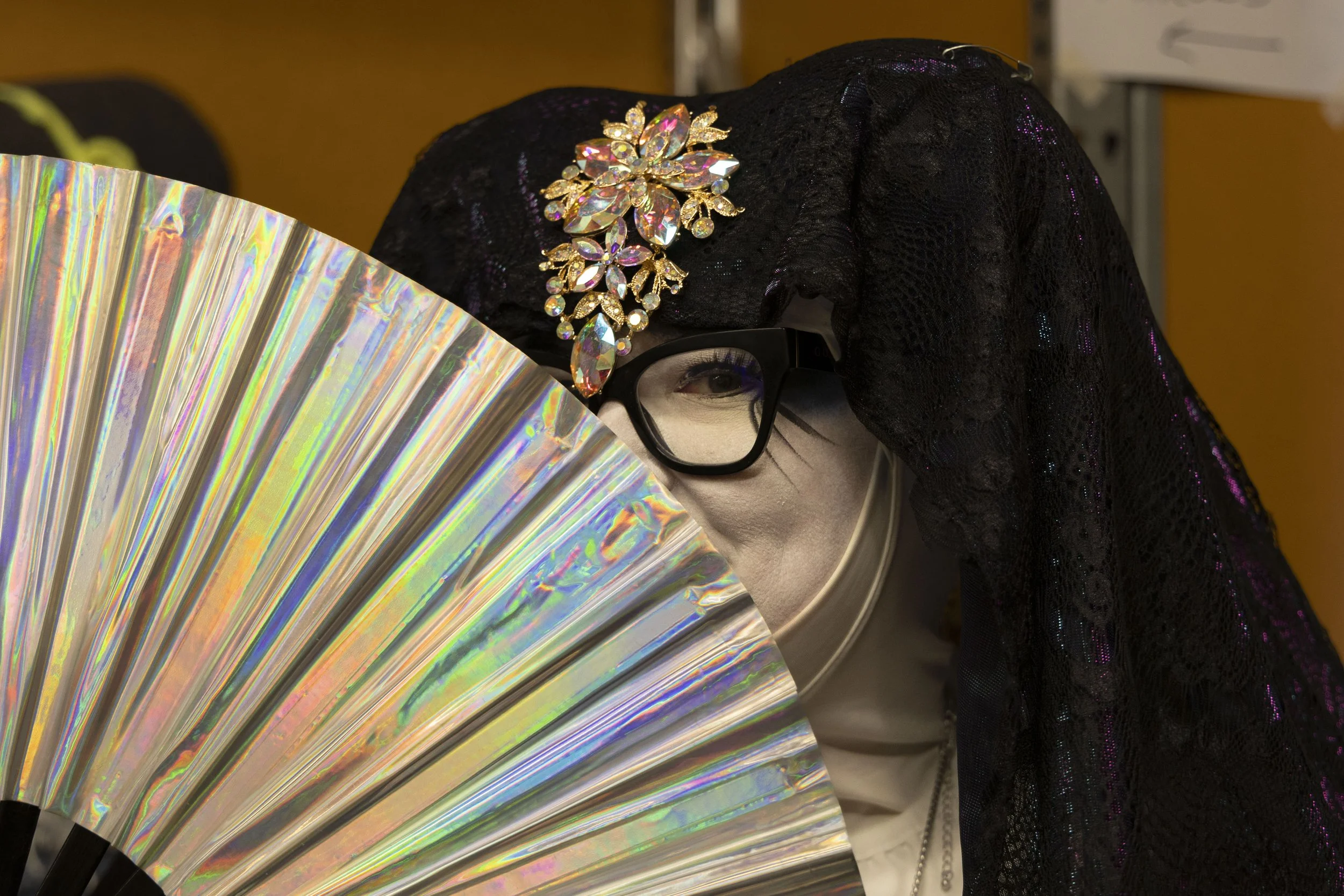 Christina Ivey (Sister Benadetta) poses for a portrait with a fan in her hand at the Hunger Sale May 1, 2026 at the University Mall in Carbondale, Illinois. 